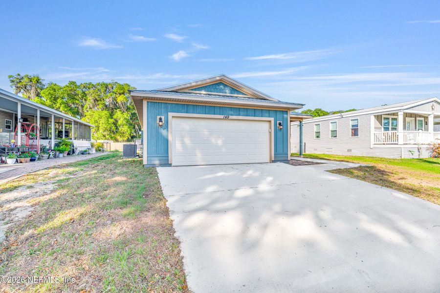 Front exterior of a new home in , Satsuma, FL, highlighting curb appeal (Image 14).