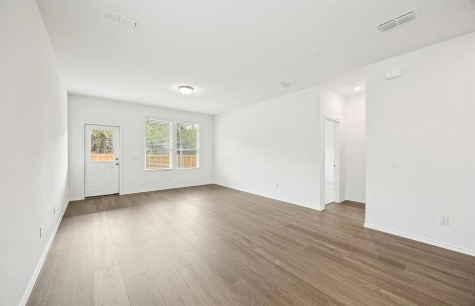 Airy gathering room showcases open concept floorplan Airy gathering room showcases open concept floorplan