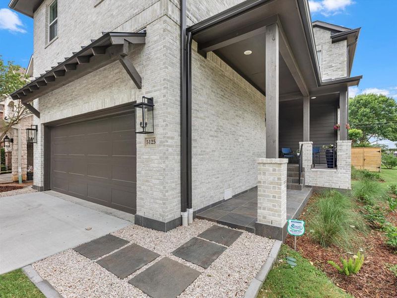 Thoughtful planning went into the construction of the front porch, offering a welcoming and serene point of access.