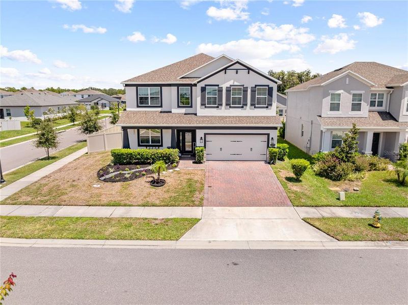 Front exterior of a new home in Eden at Crossprairie, St. Cloud, FL, highlighting curb appeal (Image 25).