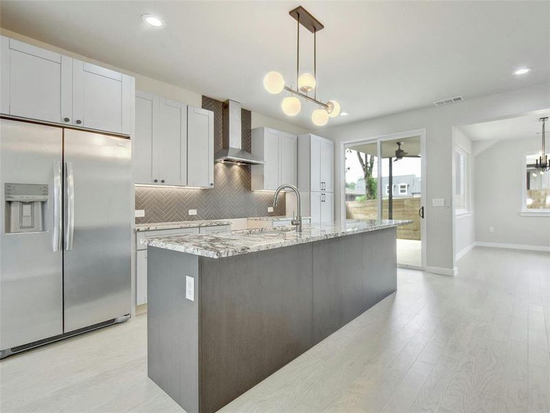 Stylish and durable granite countertops enhance the kitchen's aesthetic, offering plenty of workspace for all your culinary adventures.