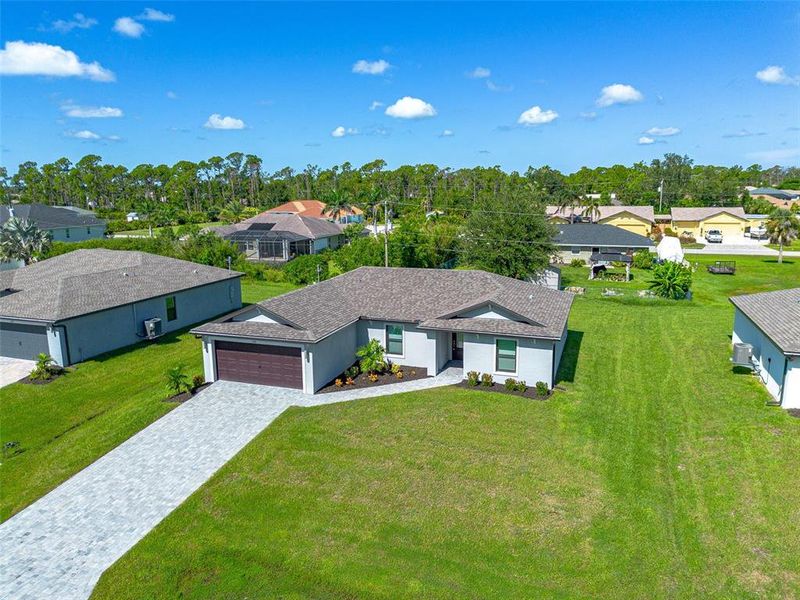Front exterior of a new home in , Port Charlotte, FL, highlighting curb appeal (Image 13).