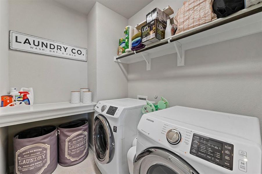 Washroom featuring washer and clothes dryer Washroom featuring washer and clothes dryer