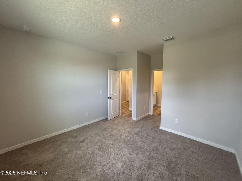 Spacious, unfurnished interior of a new home in The Cypress Series at Reserve East, Flagler Beach (Image 10).