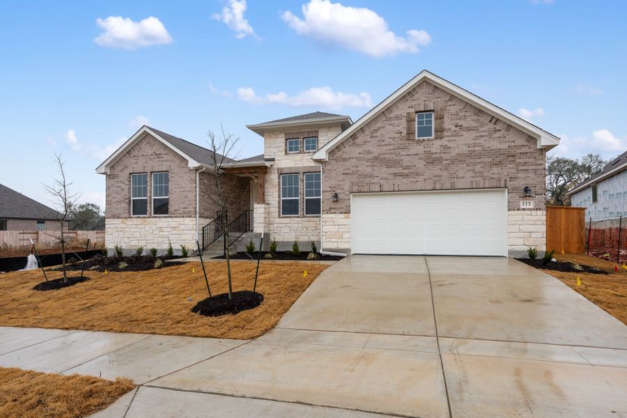 Representative exterior photo of a completed home built from the Carolina by Ashton Woods in The Estates at La Cima, San Marcos, TX (Image 2). Representative exterior photo of a completed home built from the Carolina by Ashton Woods in The Estates at La Cima, San Marcos, TX (Image 2).