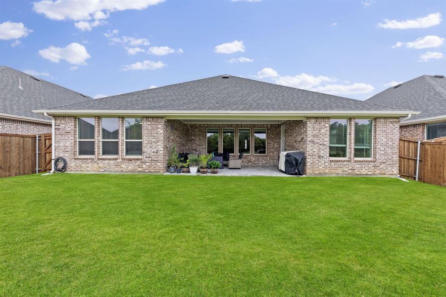 Exterior details and patio area of a home in Valencia On The Lake, Little Elm (Image 25). Exterior details and patio area of a home in Valencia On The Lake, Little Elm (Image 25).