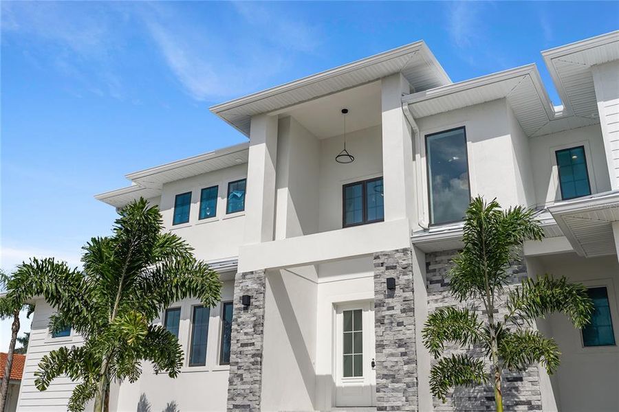 Front exterior of a new home in , Longboat Key, FL, highlighting curb appeal (Image 32). Front exterior of a new home in , Longboat Key, FL, highlighting curb appeal (Image 32).