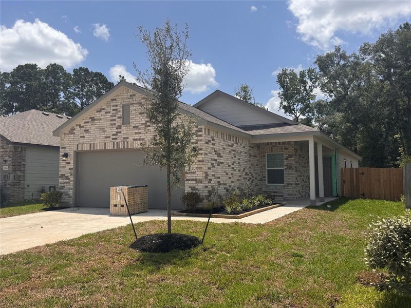 Front exterior of a new home in Granger Pines, Conroe, TX, highlighting curb appeal (Image 2). Front exterior of a new home in Granger Pines, Conroe, TX, highlighting curb appeal (Image 2).