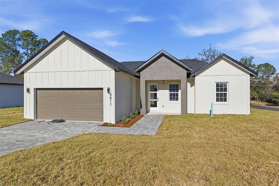 Front exterior of a new home in , Ocala, FL, highlighting curb appeal (Image 19).