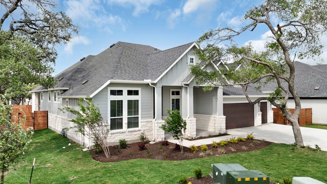 Front exterior of a new home in Broken Oak, Georgetown, TX, highlighting curb appeal (Image 2). Front exterior of a new home in Broken Oak, Georgetown, TX, highlighting curb appeal (Image 2).