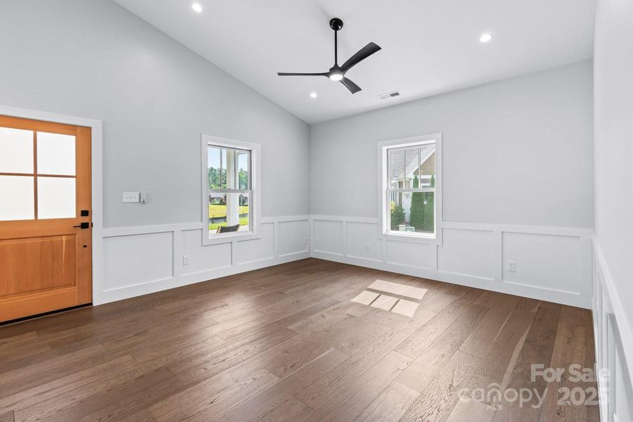 Thoughtfully designed for energy efficiency and low-maintenance living, this single-level home offers an inviting, open floor plan with vaulted ceilings, and oak hardwood floors.
