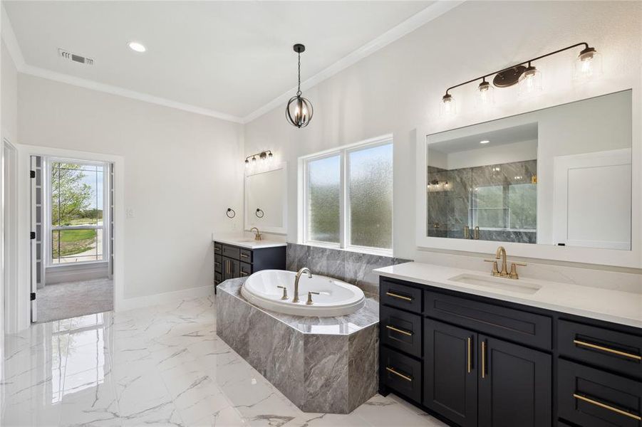 Bathroom with ornamental molding, shower with separate bathtub, tile patterned flooring, and dual bowl vanity