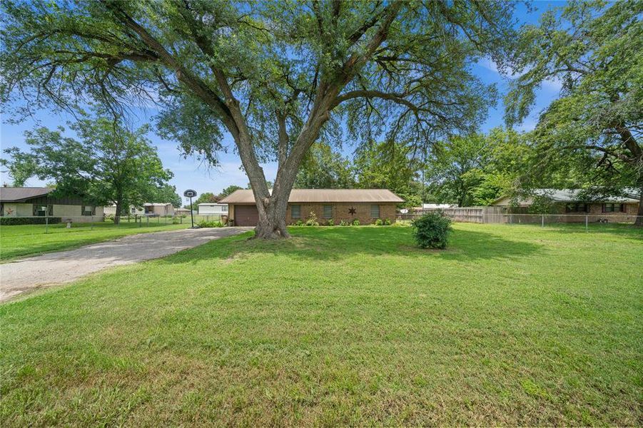 View of front of home featuring driveway and an attached garage