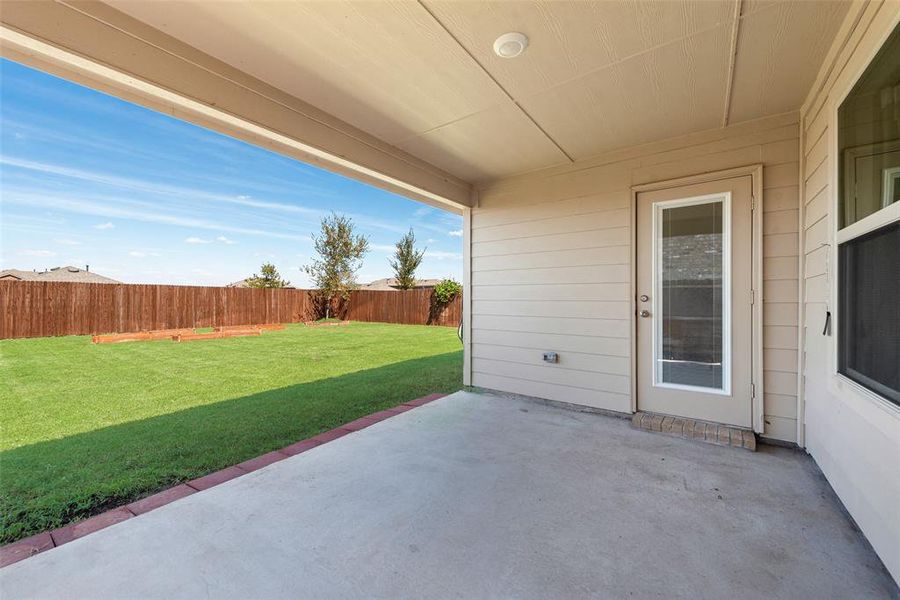 Rear view of property featuring a patio, a fenced backyard, and a shingled roof Rear view of property featuring a patio, a fenced backyard, and a shingled roof