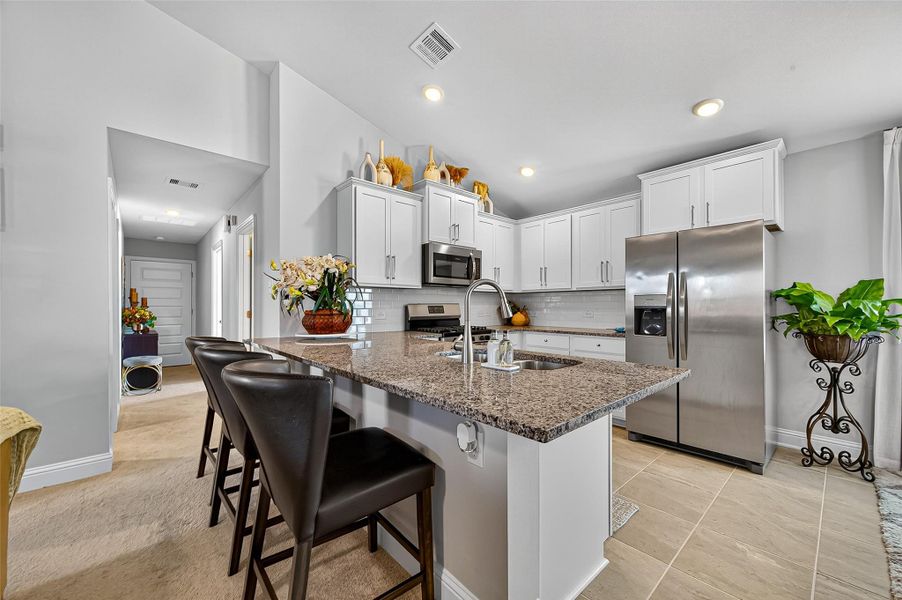 Furnished interior view inside a new home in Sunterra, Katy (Image 8).