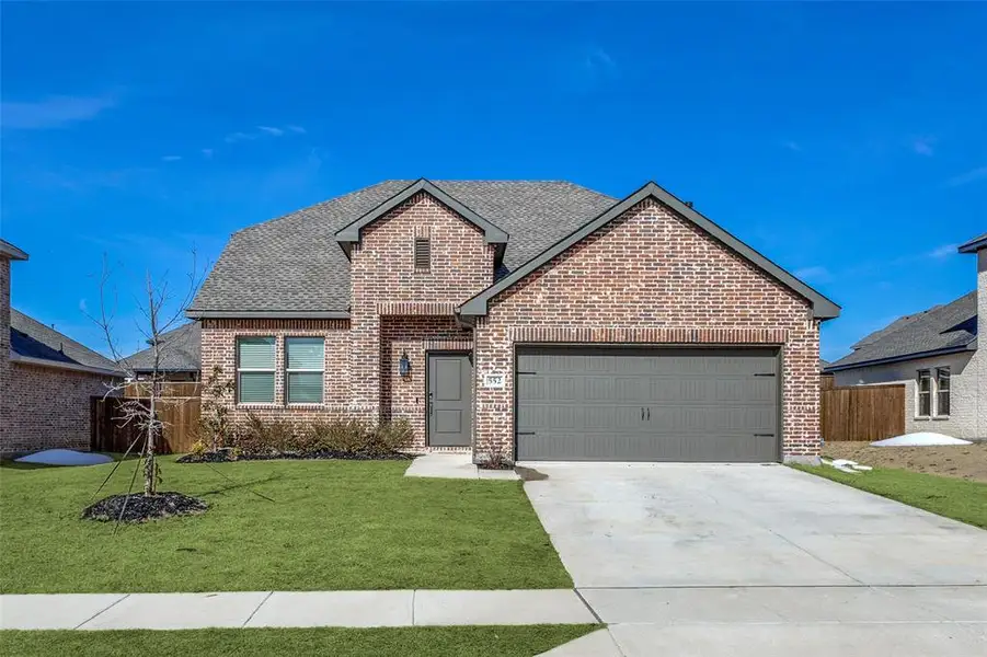Front exterior of a new home in Rolling Ridge, Van Alstyne, TX, highlighting curb appeal (Image 1). Front exterior of a new home in Rolling Ridge, Van Alstyne, TX, highlighting curb appeal (Image 1).