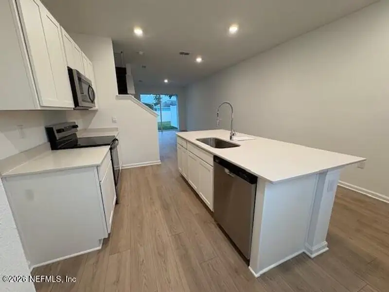 Furnished interior view inside a new home in Cordera Townhomes, St. Augustine (Image 3).
