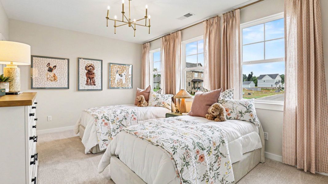 Secondary Bedroom with carpet and windows