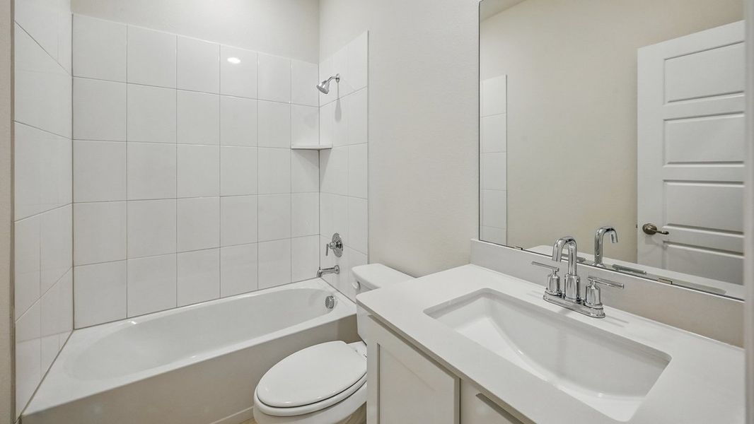 Representative furnished interior of a home built from the Medbourne by D.R. Horton in Fireside by the Lake, Garland (Image 4).