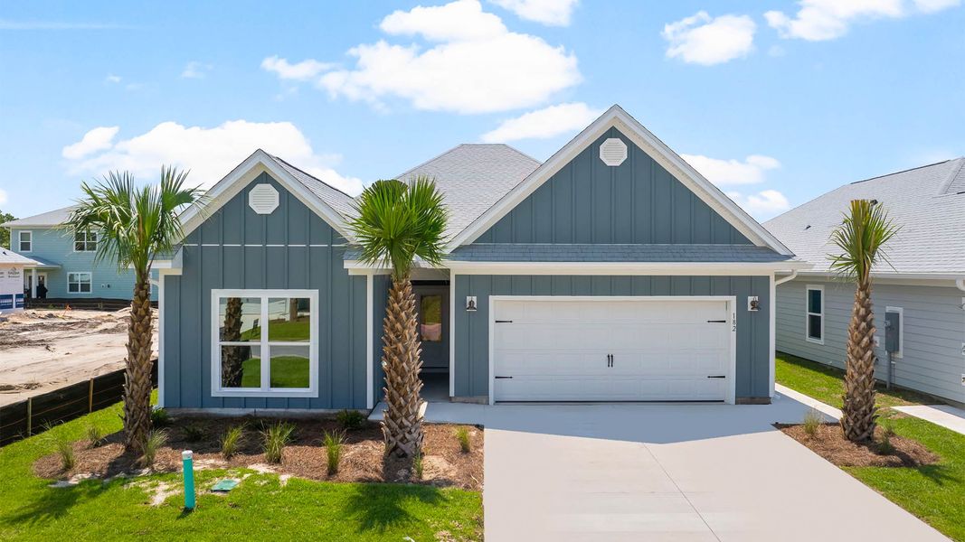 Front exterior of a new home in Windmark Beach, Port Saint Joe, FL, highlighting curb appeal (Image 1). Front exterior of a new home in Windmark Beach, Port Saint Joe, FL, highlighting curb appeal (Image 1).
