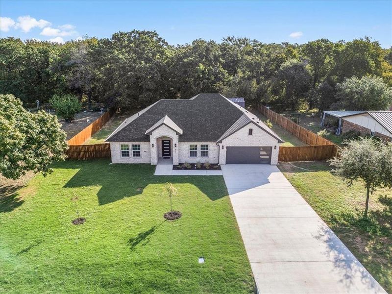 View of front facade with a garage and a front yard