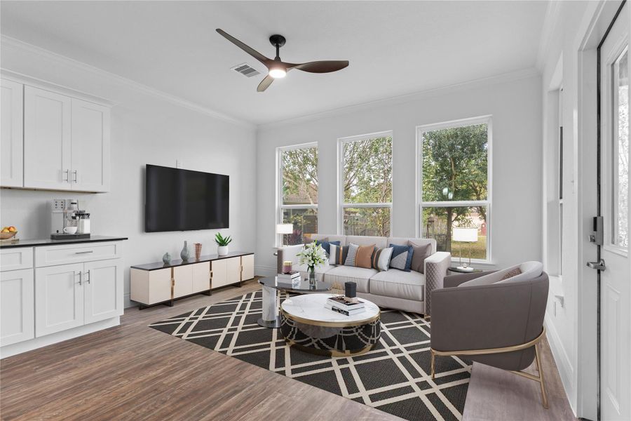 The family area offers a stunning view of nature through custom tall windows that fill the space with natural light. Elegant crown molding throughout adds a sophisticated touch of style. Virtually staged to help you imagine the incredible lifestyle waiting for you—what a beautiful place to come home to! The family area offers a stunning view of nature through custom tall windows that fill the space with natural light. Elegant crown molding throughout adds a sophisticated touch of style. Virtually staged to help you imagine the incredible lifestyle waiting for you—what a beautiful place to come home to!