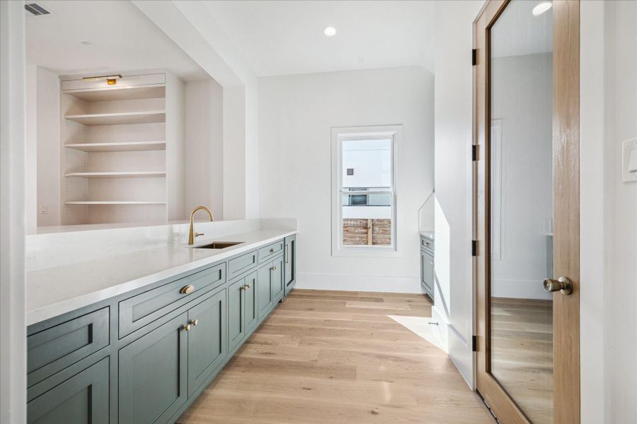 Wet bar area and wine storage. Wet bar area and wine storage.