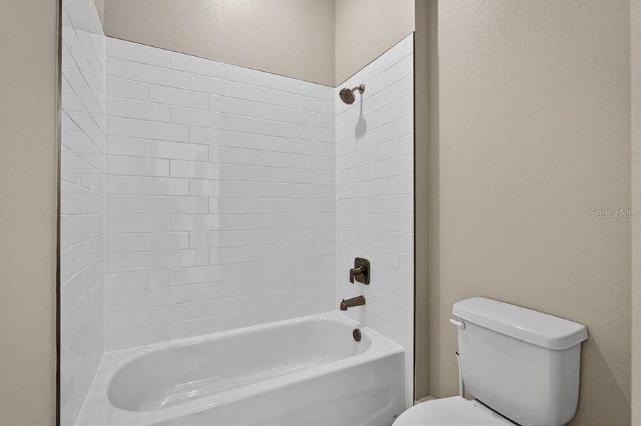 Furnished interior view inside a new home in Gray Hawk at Hole Two, Daytona Beach (Image 17).