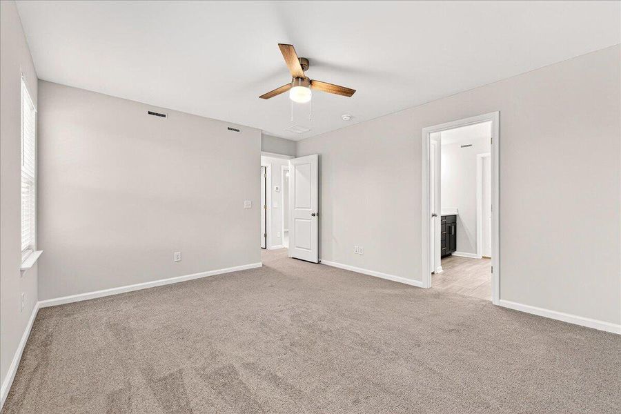 Spacious, unfurnished interior of a new home in Jasmine Point at Lakes of Cane Bay, Summerville (Image 27).