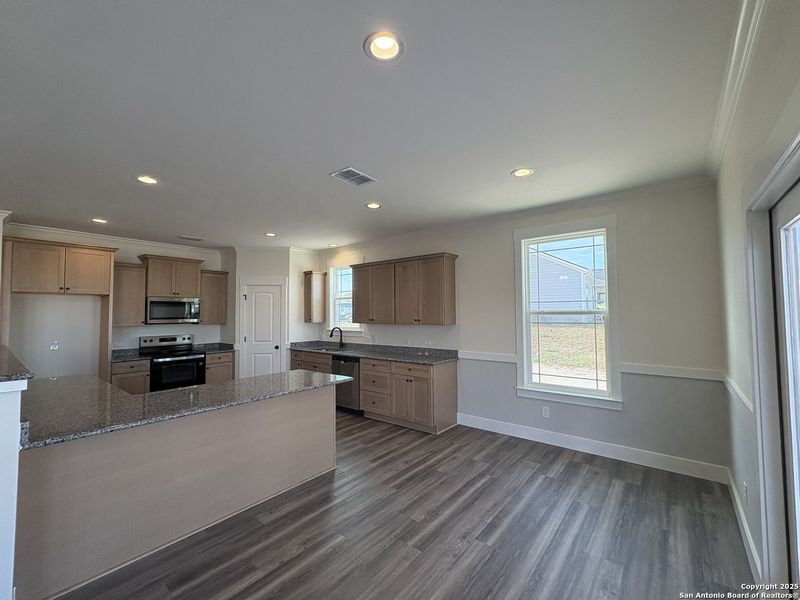 Furnished interior view inside a new home in Las Palomas Country Club Estates, La Vernia (Image 3).