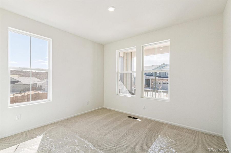 Spacious, unfurnished interior of a new home in Terrain Oak Valley, Castle Rock (Image 25).