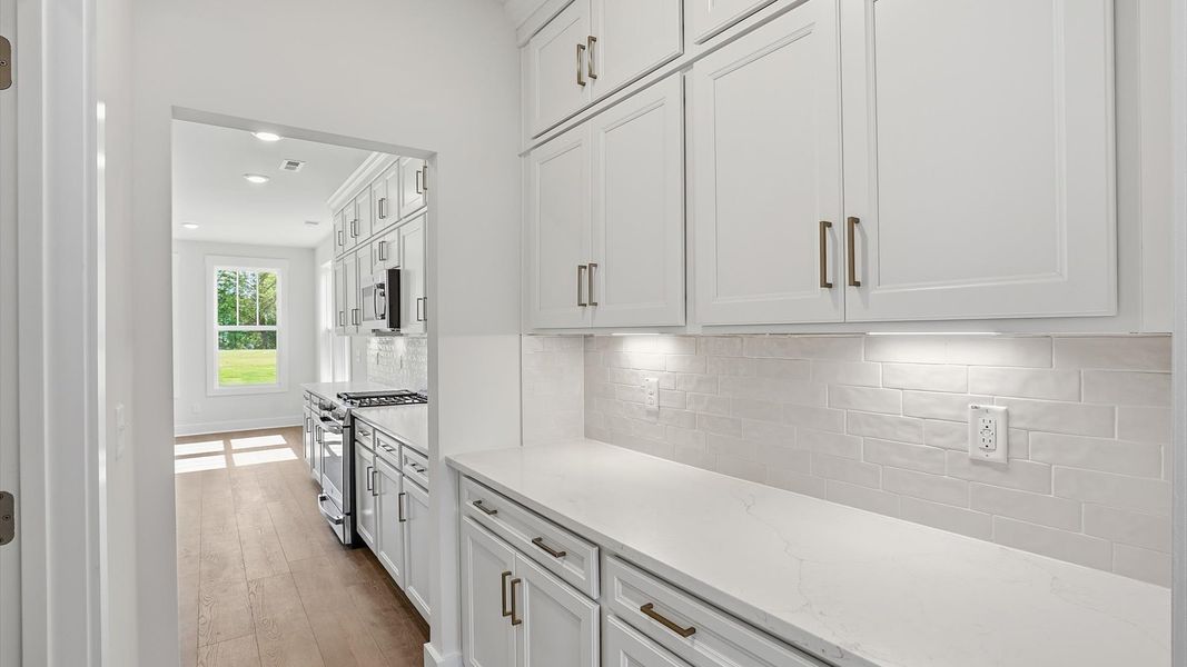 Clean lines and smart storage make this butler’s pantry both practical and polished by DRB Homes Clean lines and smart storage make this butler’s pantry both practical and polished by DRB Homes