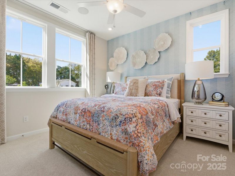 First Floor Guest Suite Filled with Light. *Model Photos | Actual Finishes, Structural Selections, and Orientation May Vary.