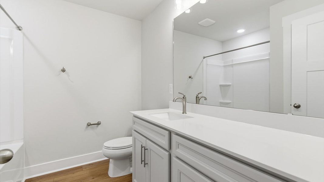 Vibrant and welcoming bathroom with elegant countertop space and polished details at Village at Midway Vibrant and welcoming bathroom with elegant countertop space and polished details at Village at Midway
