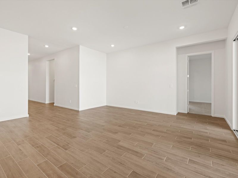 Spacious, unfurnished interior of a new home in White Tank Foothills Signature Series, Waddell (Image 14).