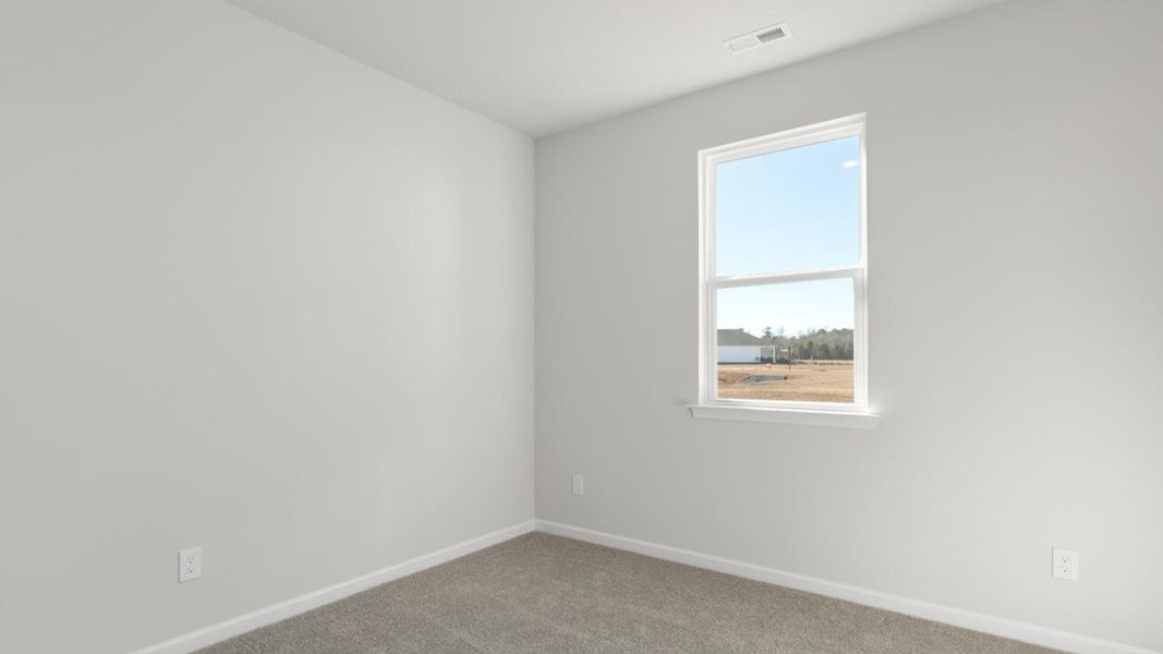 Spacious, unfurnished interior of a new home in Indigo Preserve, Leland (Image 24).