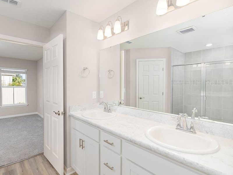 Your suite is complete with a large walk-in wardrobe and en-suite bath - Ashlyn by Highland Homes