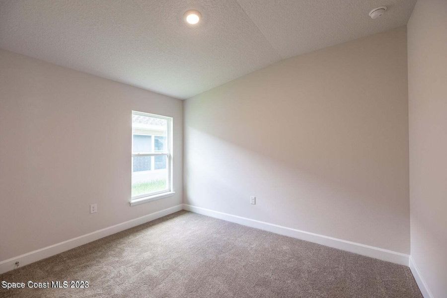 Representative unfurnished interior of a home built from the 1415 by Adams Homes in Winding Oaks, Weeki Wachee (Image 14).
