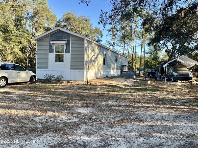 Exterior details and patio area of a home in , Satsuma (Image 2). Exterior details and patio area of a home in , Satsuma (Image 2).