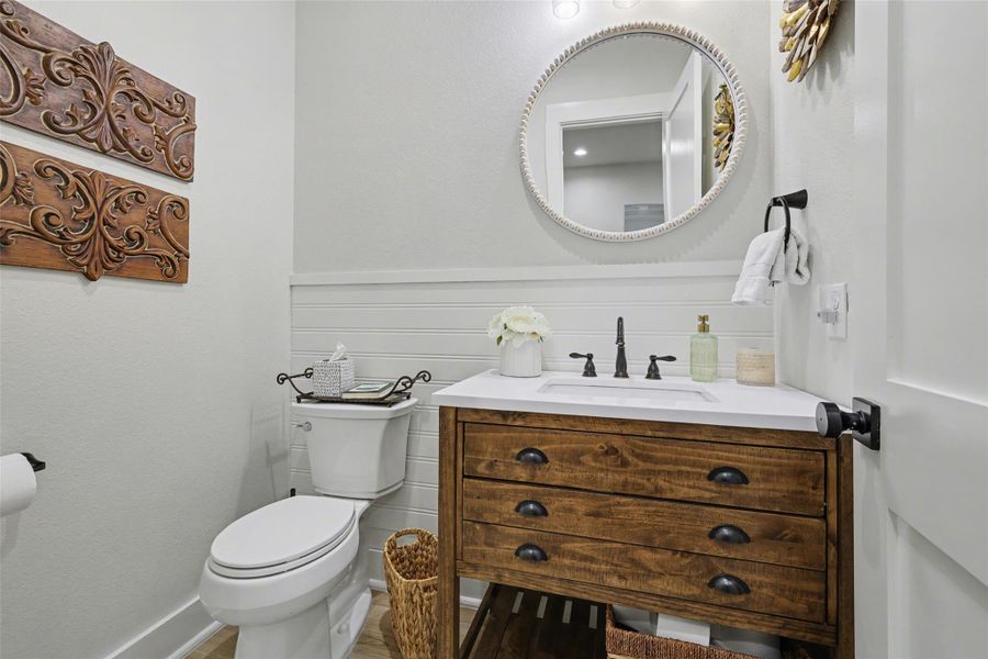 Powder Bathroom with vanity and toilet