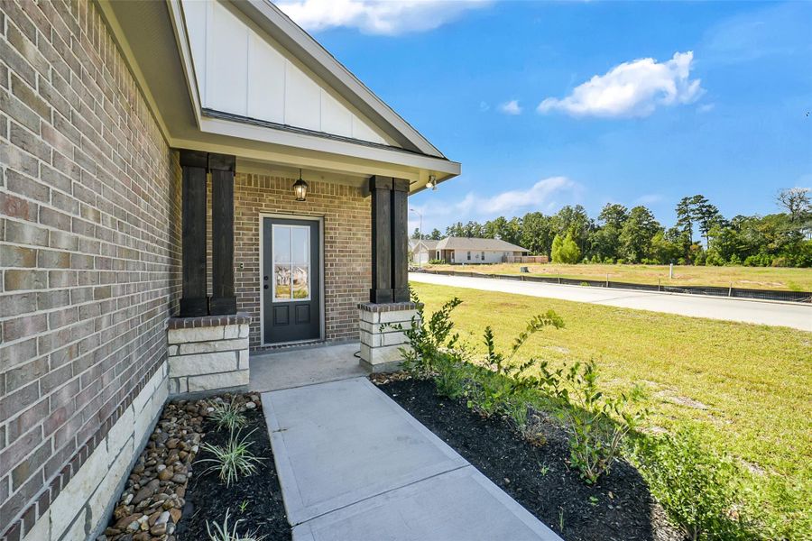Exterior details and patio area of a home in Mostyn Springs, Magnolia (Image 20).