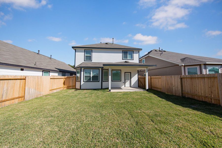 Exterior details and patio area of a home in Mackenzie Creek, Conroe (Image 3). Exterior details and patio area of a home in Mackenzie Creek, Conroe (Image 3).
