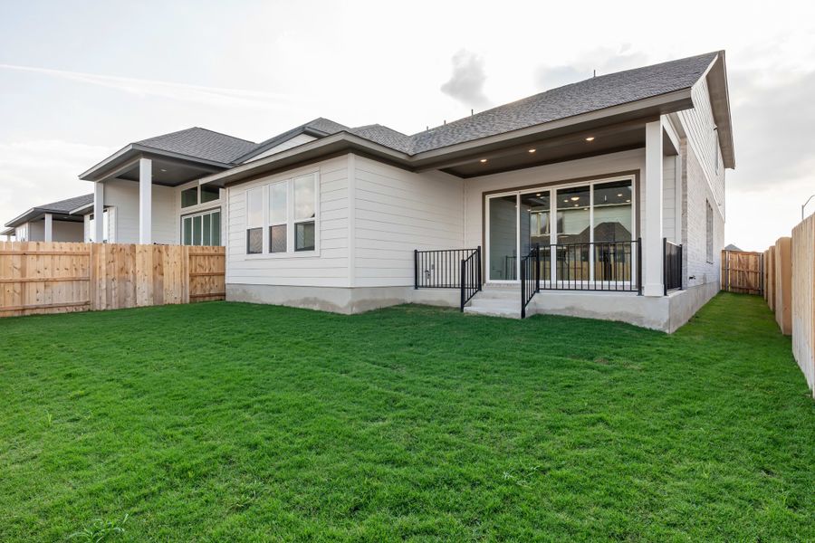 Exterior details and patio area of a home in Lariat, Liberty Hill (Image 30).