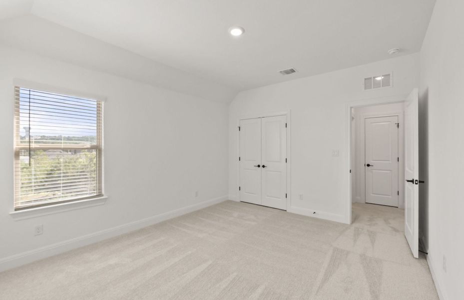 Representative unfurnished interior of a home built from the Wallace by Pulte Homes in Bluffview Reserve, Leander (Image 16).