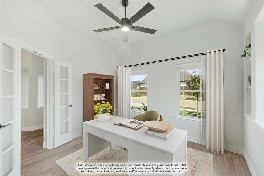 Home office with white desk, vaulted ceiling, ceiling fan, and French doors on hardwood floors Home office with white desk, vaulted ceiling, ceiling fan, and French doors on hardwood floors