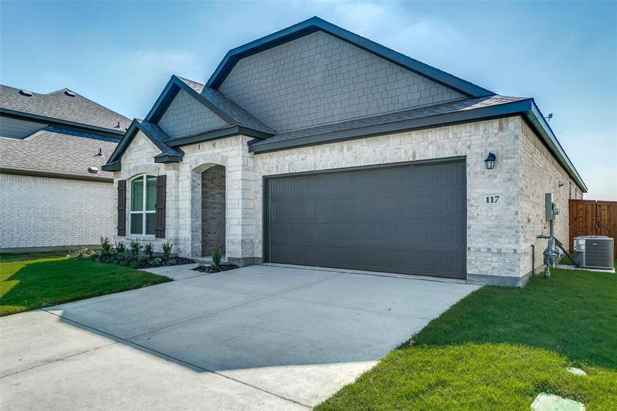 Front exterior of a new home in The Preserve, Justin, TX, highlighting curb appeal (Image 2). Front exterior of a new home in The Preserve, Justin, TX, highlighting curb appeal (Image 2).