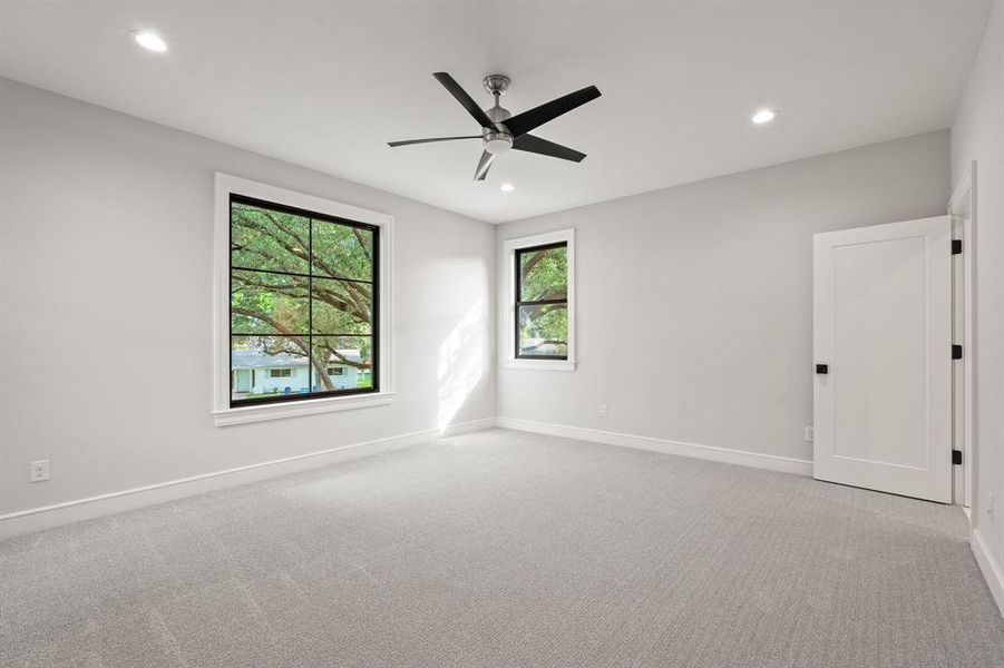 Unfurnished room featuring light colored carpet, recessed lighting, and a ceiling fan Unfurnished room featuring light colored carpet, recessed lighting, and a ceiling fan