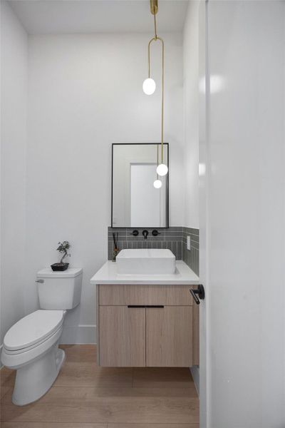 Powder room off the hallway, with modern and designer selections. Powder room off the hallway, with modern and designer selections.