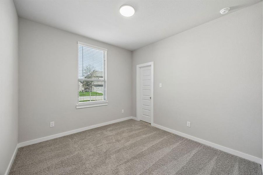Bedroom in the Emmy II home plan by Trophy Signature Homes - REPRESENTATIVE PHOTO