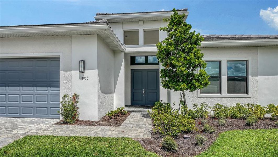 Exterior details and patio area of a home in Artistry Sarasota, Sarasota (Image 30).